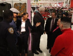 A group of people standing around in a store.