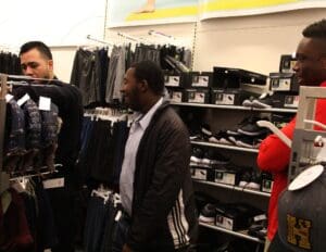 A group of people shopping in a store.