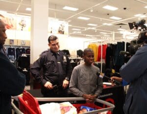 A group of people in a store with shopping carts.