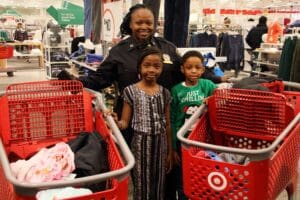 A woman and two children posing for the camera.