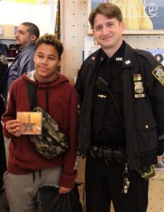 A man and boy standing next to each other.