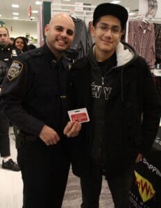 Two men in police uniforms posing for a picture.