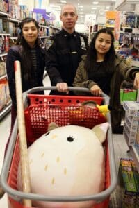 A group of people shopping in a store.