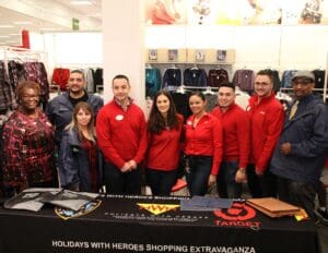 A group of people in red shirts and black jackets.