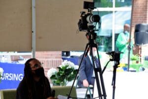 A man sitting in front of a camera.