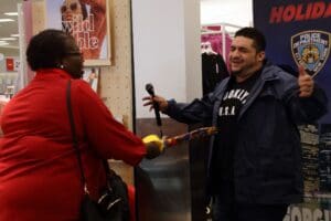 A man holding a microphone and a woman.