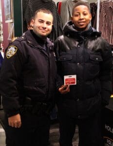 Two men in police uniforms standing next to each other.