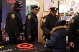 A group of police officers standing around an open target.