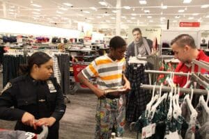 A group of people shopping in a department store.