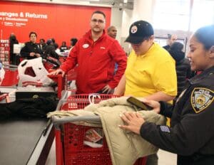 A group of people in a store with some items.