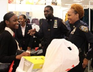 A group of people in police uniforms are handing out gifts.