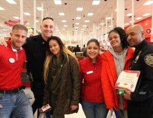 A group of people standing in a store together.